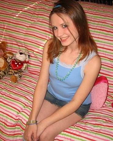 Kitty in her bedroom with stuffed animals