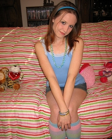 Kitty in her bedroom with stuffed animals