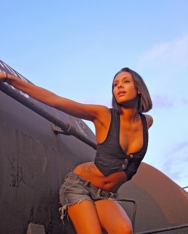 Danica poses on a rail road car