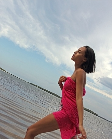 Danica drenches herself with beach water