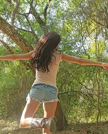 Layla Danica outside playing with her hair