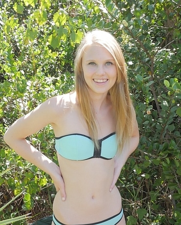 Lily Rader in her bikini outside