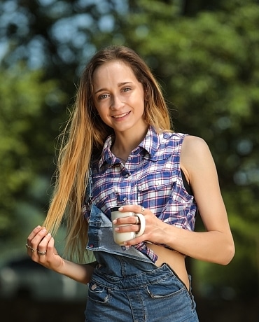 Melody in overalls getting naked playing with a toy