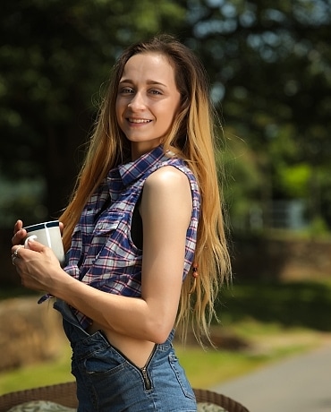 Melody in overalls getting naked playing with a toy