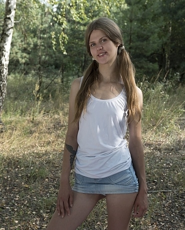 Rosa in blue jean mini & tube socks outdoors